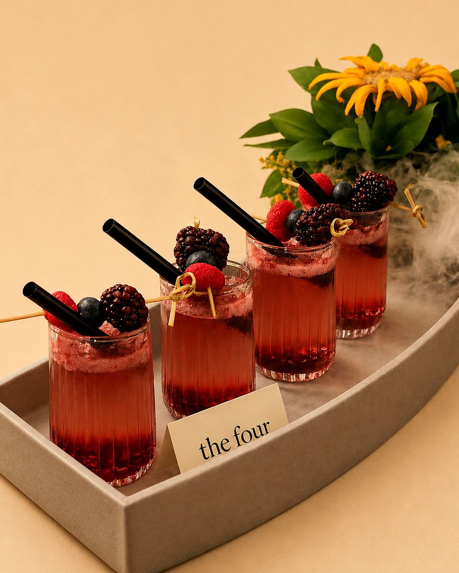 berry mojitos with dry ice smoke on a tray