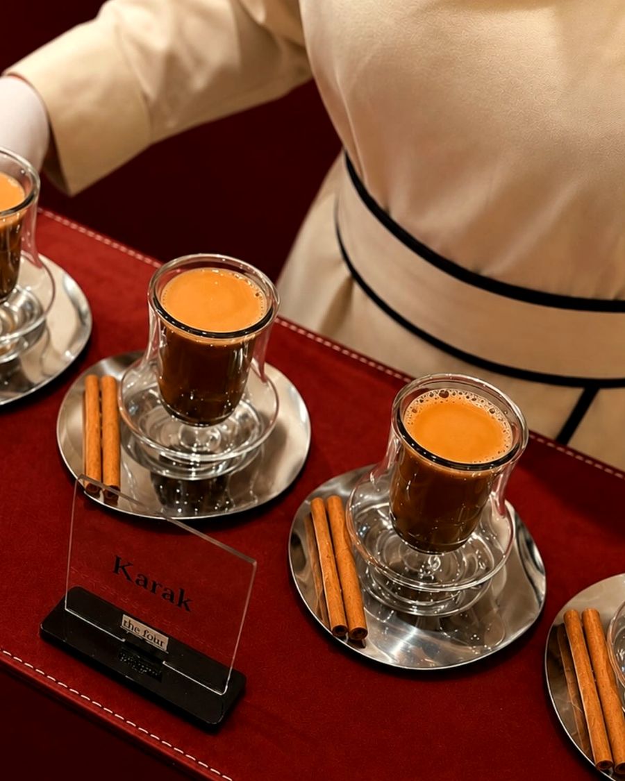 karak served in glass cups on a red runner